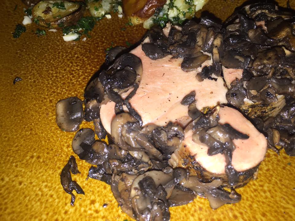 Rare pork tenderloin with sauteed mushrooms