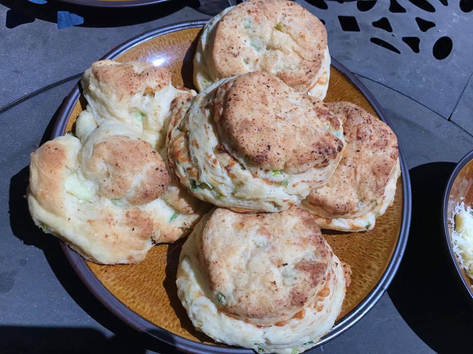 Cheddar and scallions buttermilk biscuits with a sausage grav
