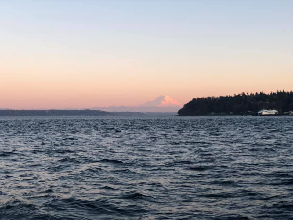 The setting sun coloring Mount Rainier red