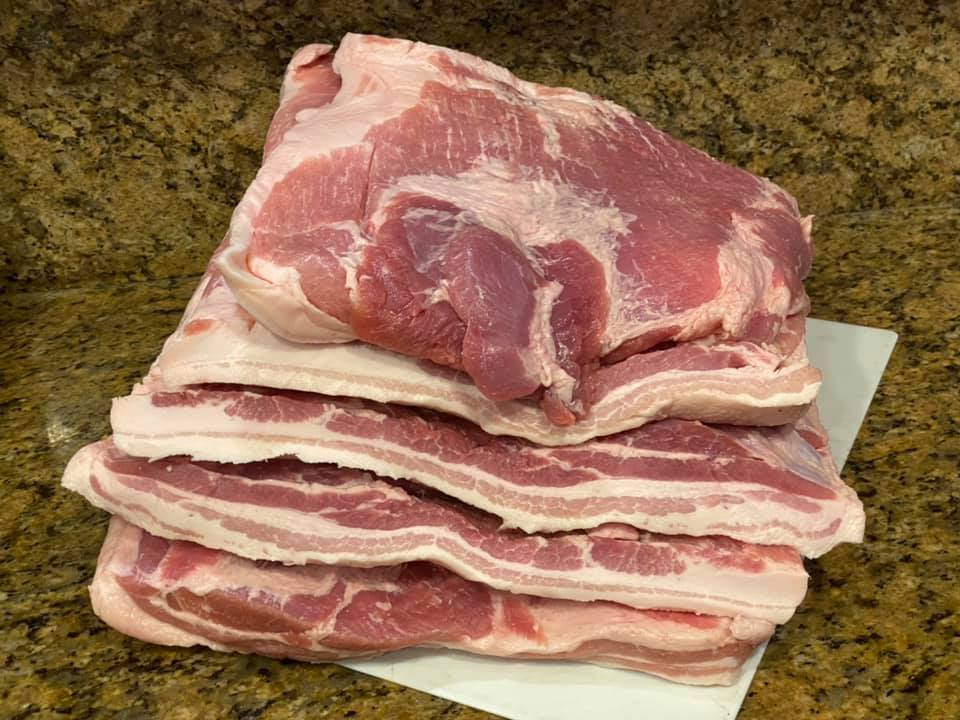 Three pork bellies are dry brining