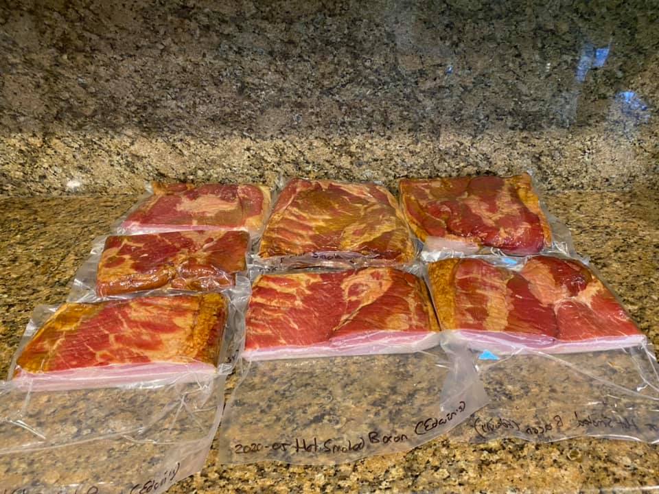 Bacon is cut into manageable chunks and vacuum packed…